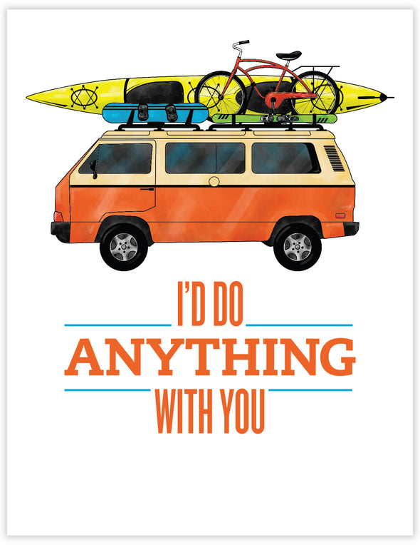 orange and cream volkswagen camper van with sea kayak, snowboard, skis and a bike on the roof.